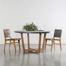 PRE ORDER  |  MALAND WOVEN LEATHER DINING CHAIR  |  BLACK LEATHER HIDE + ARIA ROUND DINING TABLE