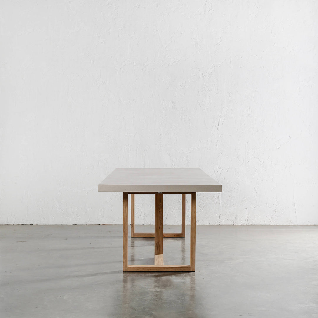 ARIA HALMSTAD DINING TABLE  |  SAHARA CIMENT + TEAK LEGS END VIEW