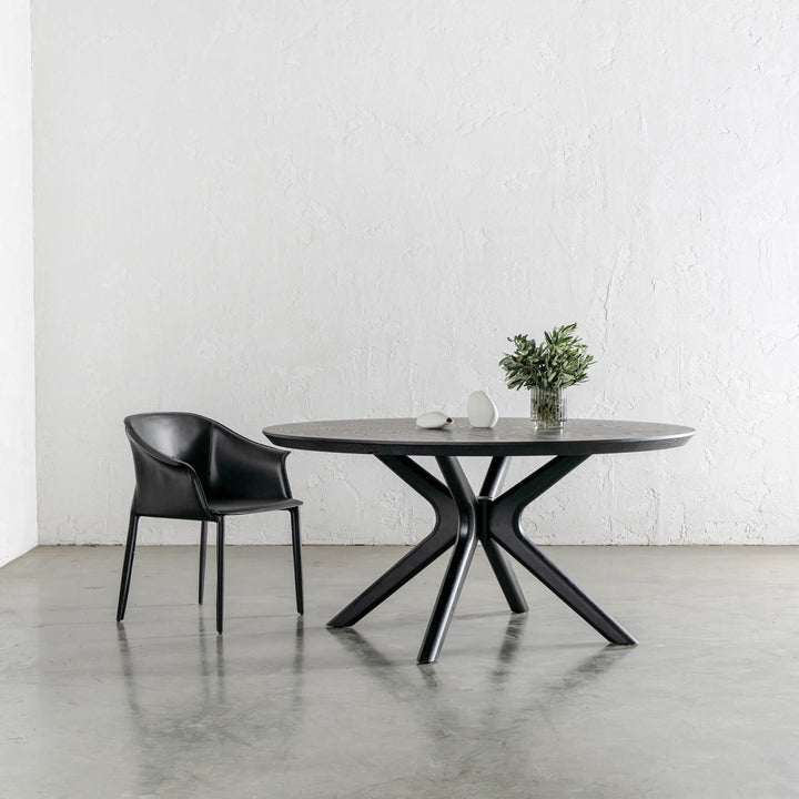 TREGOR MID CENTURY VEGAN LEATHER DINING CHAIR  |  NOIR BLACK + BRETON DINING TABLE