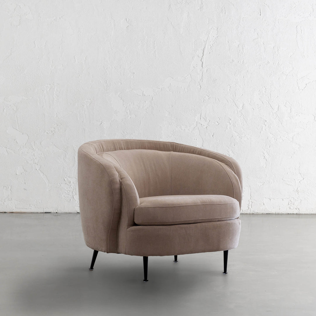 CARSON CURVE ARMCHAIR | DESERT SAND TEXTURED VELOUR | ANGLE