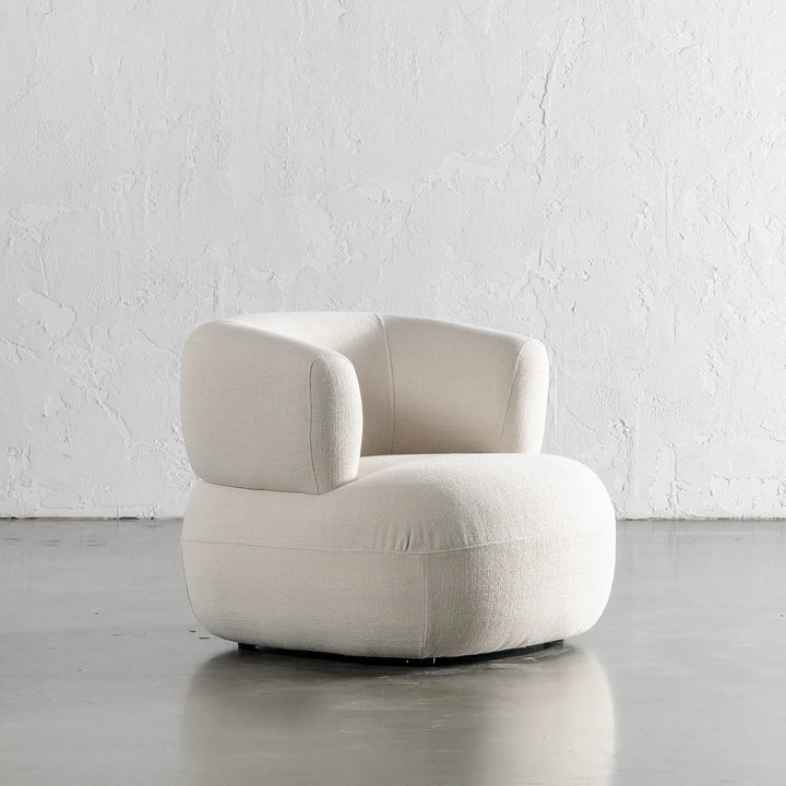 CARSON ROUNDED ARMCHAIR ANGLED  |  SKIMMING STONE WEAVE