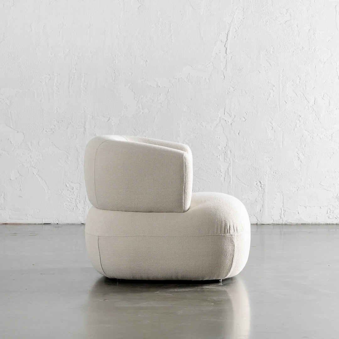 CARSON ROUNDED ARMCHAIR SIDE VIEW  |  SKIMMING STONE WEAVE