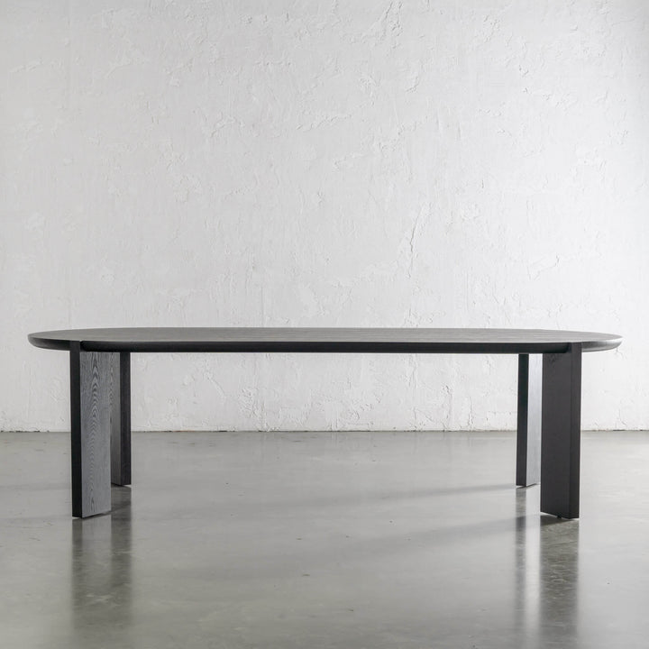 CASSAN ROUNDED DINING TABLE  |  BLACK NOIR WOOD GRAIN  