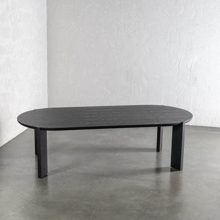 CASSAN ROUNDED DINING TABLE  |  BLACK NOIR WOOD GRAIN 