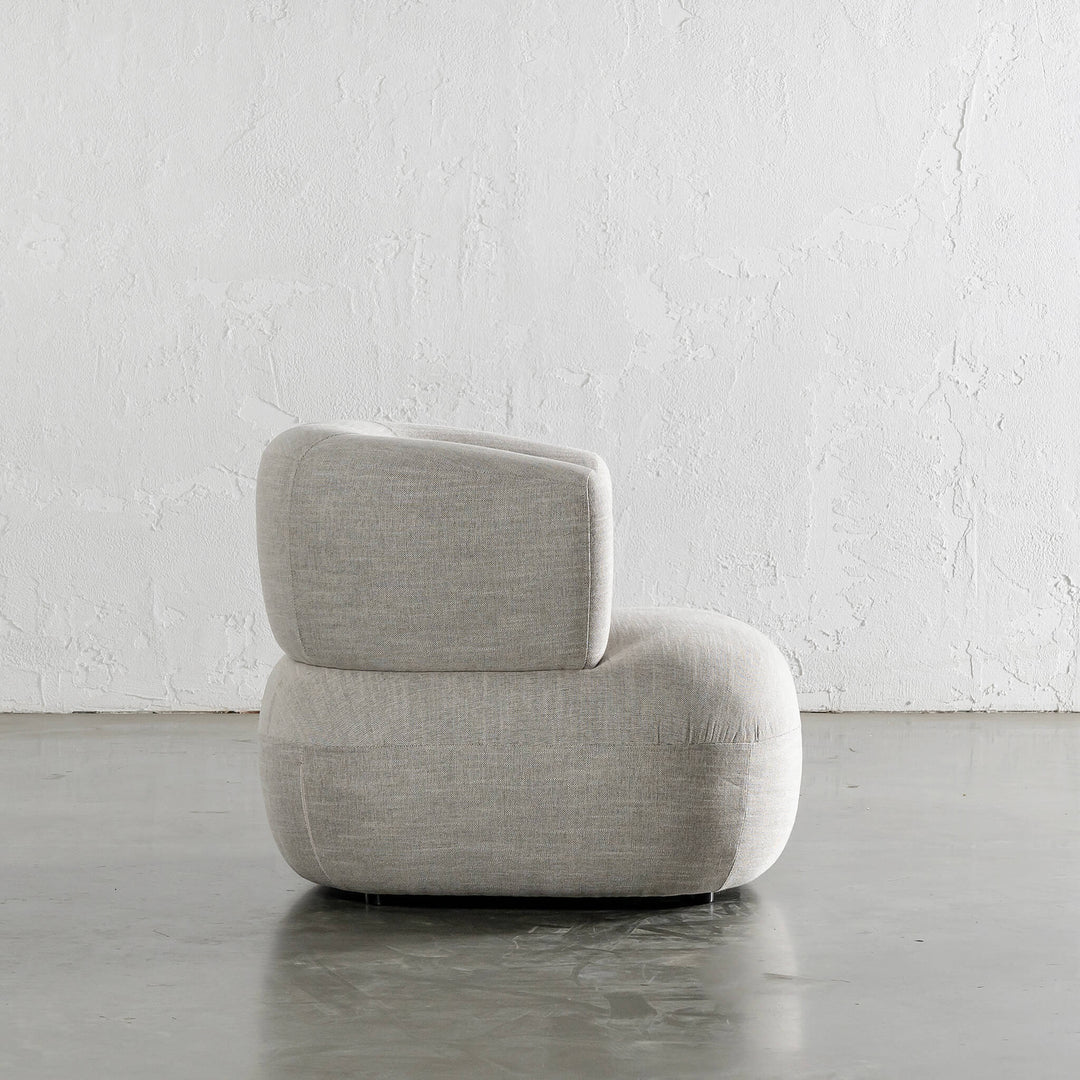 CARSON ROUNDED ARMCHAIR SIDE VIEW  |  JOVAN EARTH