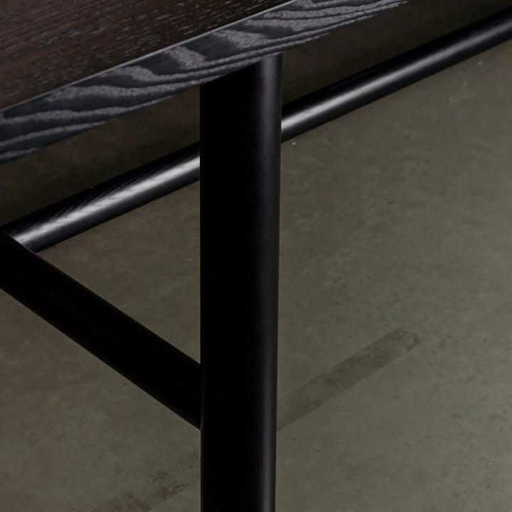 NOMA TRESTLE DINING TABLE  |  BLACK NOIR WOOD GRAIN CLOSE UP