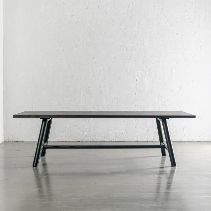 NOMA TRESTLE DINING TABLE  |  BLACK NOIR WOOD GRAIN UNSTYLED