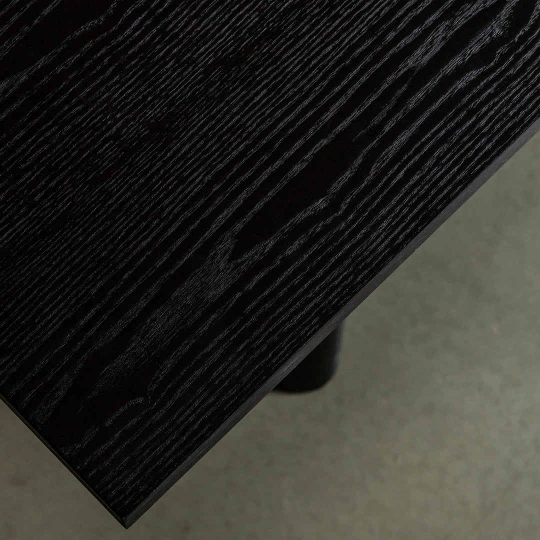 NOMA TRESTLE DINING TABLE  |  BLACK NOIR WOOD GRAIN CLOSE UP