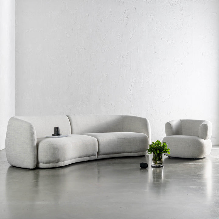 PURBECK CURVED SOFA + CARSON ROUNDED ARMCHAIR  |  AMMONITE SILVER