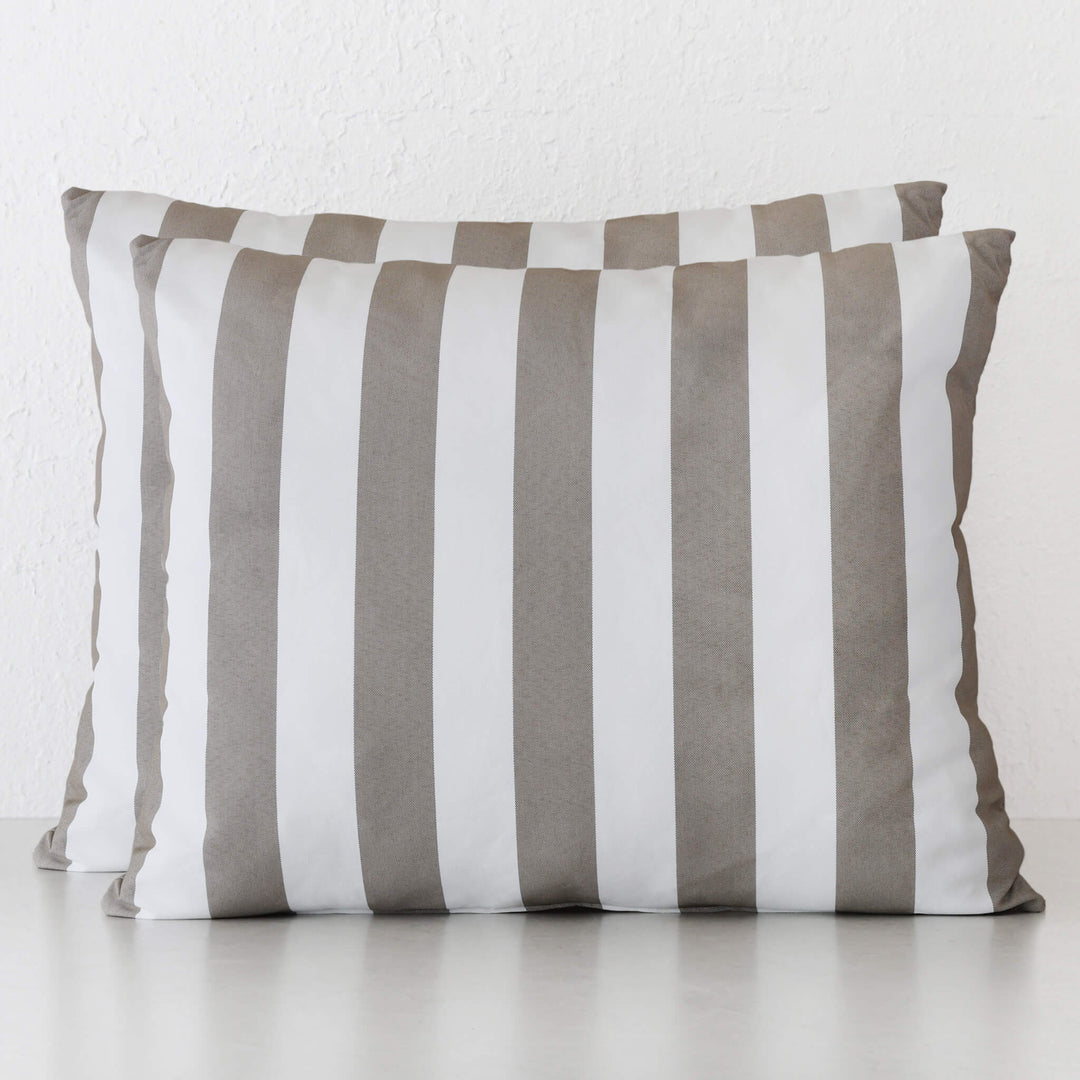Square cushion featuring a simple pattern of wide, vertical beige and white stripes.