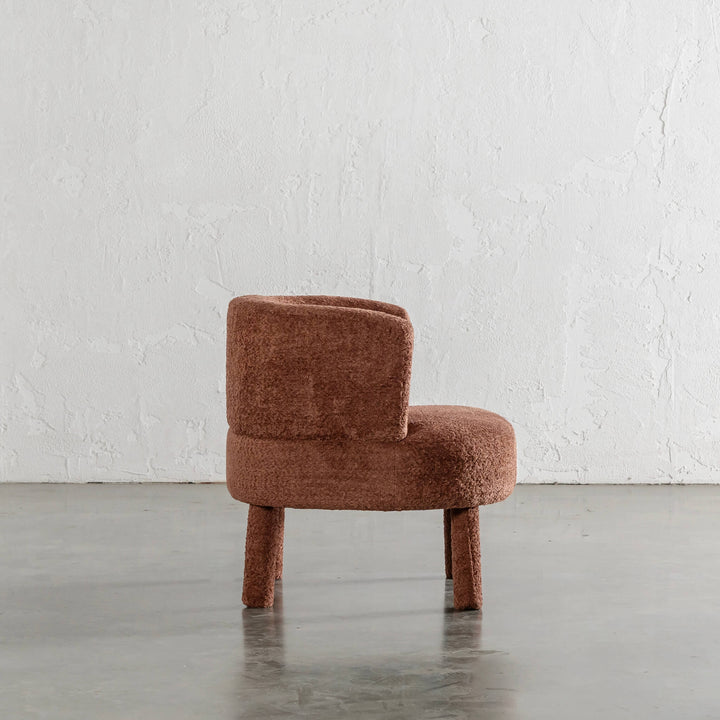 SEVILLA CURVE ARMCHAIR SIDE VIEW  |  CARMEN RUST BOUCLE