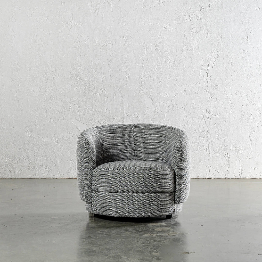 TRAVECY CURVED ARMCHAIR  |  PEPPER HAZE WEAVE