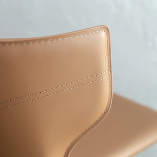 CAYDEN MID CENTURY VEGAN LEATHER DINING CHAIR CLOSE UP  |  SADDLE TAN