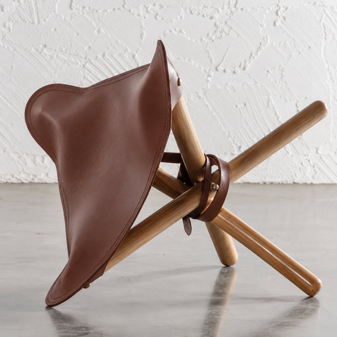 MALAND FOLDUP STOOL  |  NATURAL TEAK + TAN LEATHER HIDE