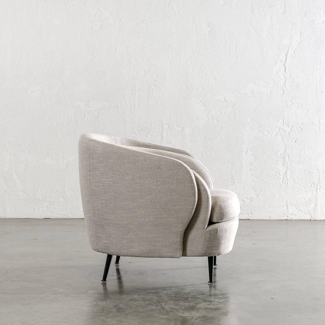 CARSON CURVE ARM CHAIR  |  JOVAN EARTH SIDE VIEW