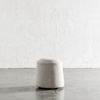 CARSON CURVE ROUND OTTOMAN  |  JOVAN DOVE NATURAL MINIMAL