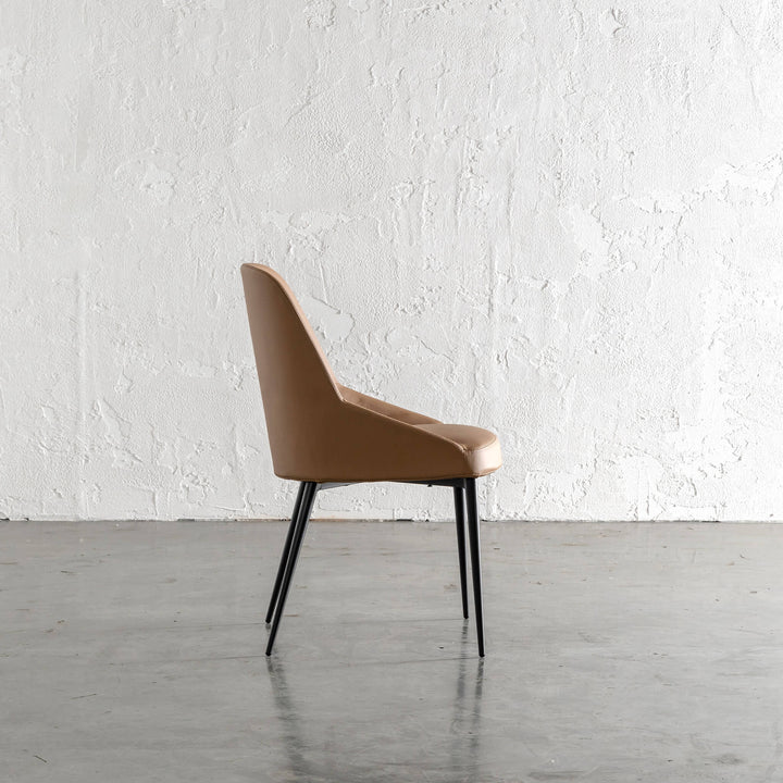 CARTER VEGAN LEATHER DINING CHAIR  |  SADDLE TAN SIDE PROFILE