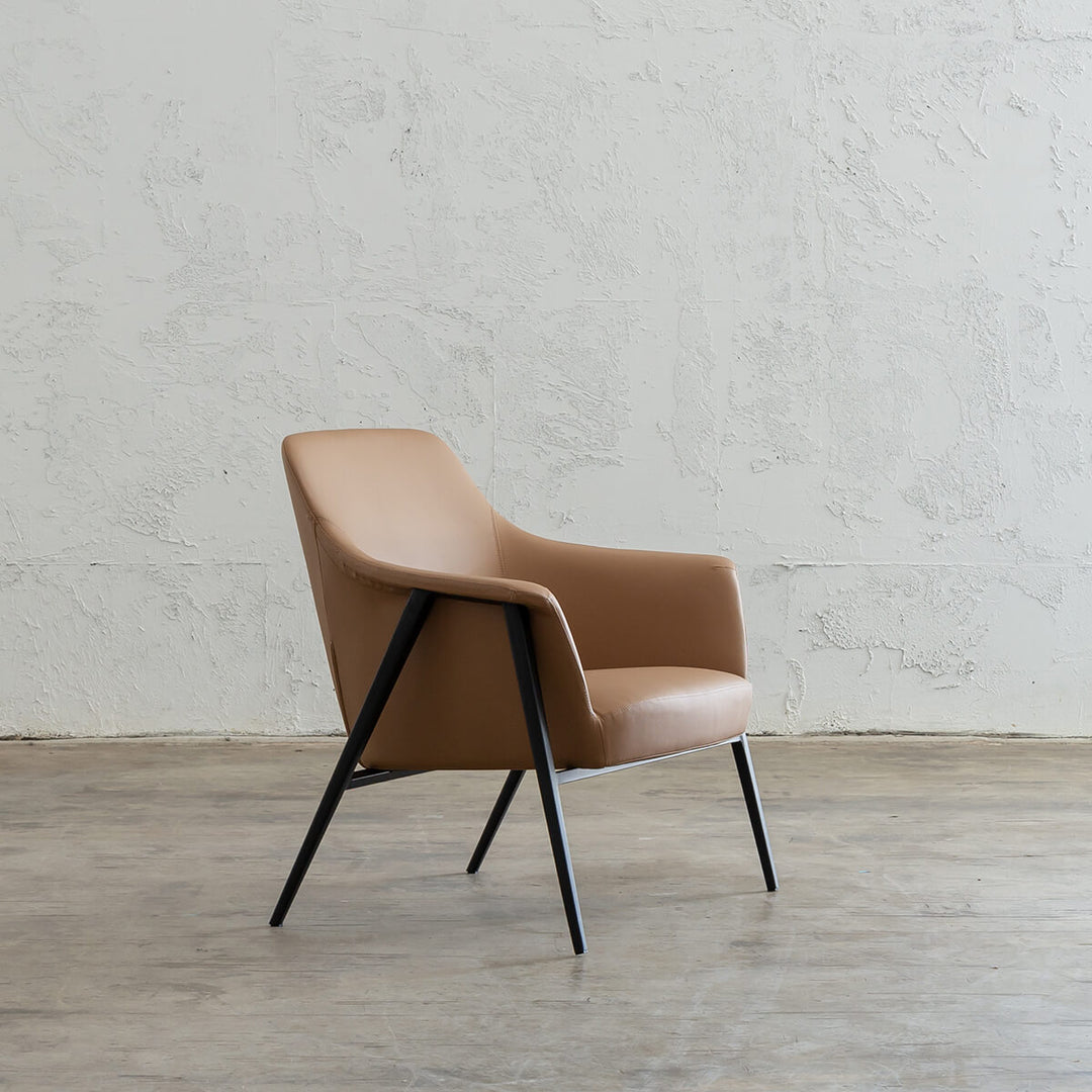 MARCUS ARM CHAIR  |  SADDLET TAN VEGAN LEATHER  |  MODERN OCCASIONAL CHAIR  | LOUNGE CHAIR ANGLE VIEW